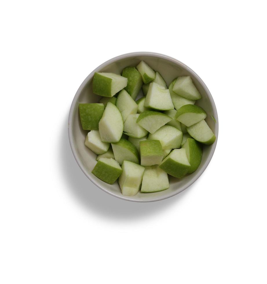 green apple in cup isolated fruit with slice and leaves isolated and collection vegetables on a white photo