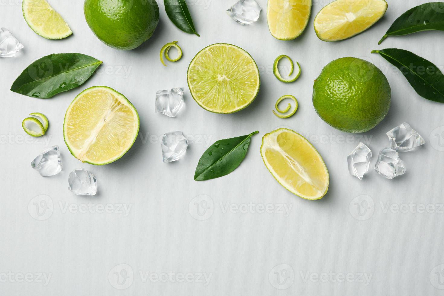 Flat lay with ripe lime on light gray background photo