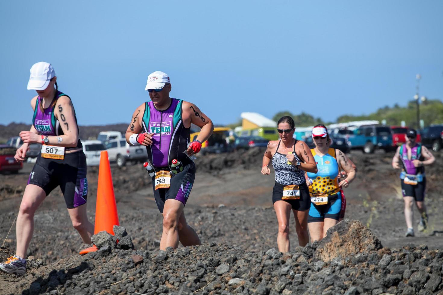 WAIKOLOA, USA, 2011 - Unidentified runners on the Lavaman Triathlon in Waikoloa, Hawaii. It is held in Olympics format - 1.5 km swimming, 40 km biking and 10 km running. photo