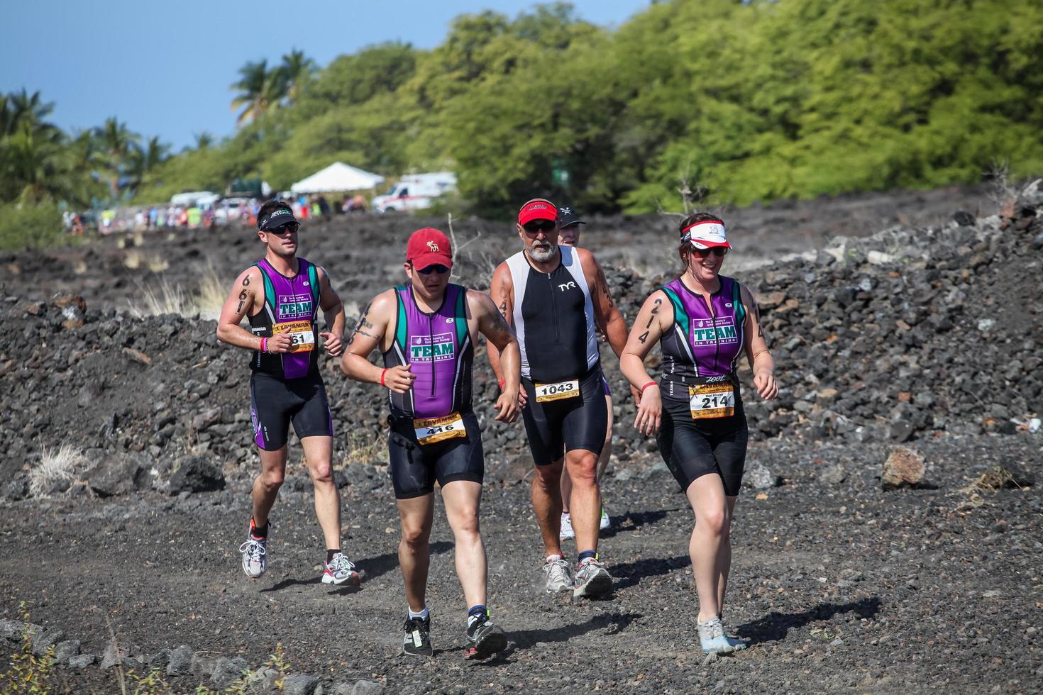 WAIKOLOA, USA, 2011 - Unidentified runners on the Lavaman Triathlon in Waikoloa, Hawaii. It is held in Olympics format - 1.5 km swimming, 40 km biking and 10 km running. photo