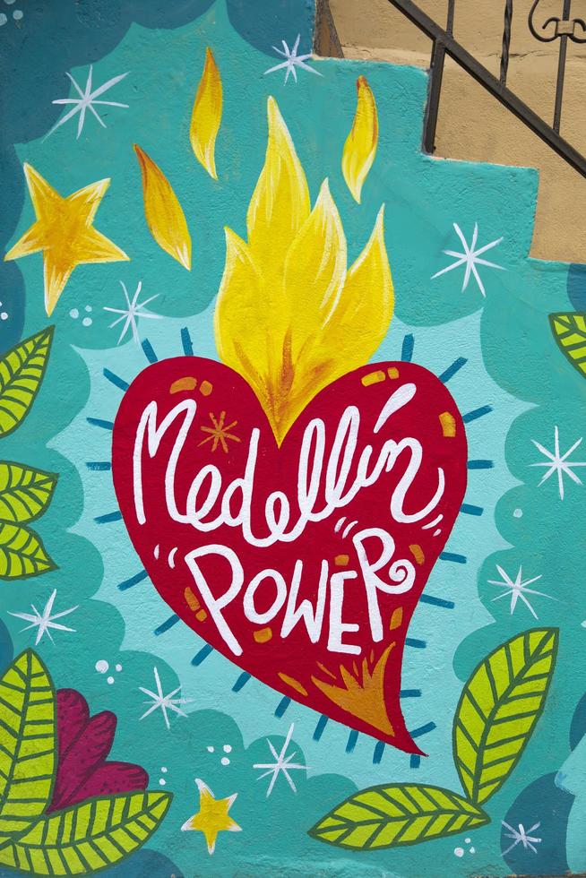 MEDELLIN, COLOMBIA, 2019 - Street art of Comuna 13 in Medellin, Colombia. Once known as Colombias most dangerous barrio, today graffiti tour is one of the most popular tourist attractions in Medellin. photo