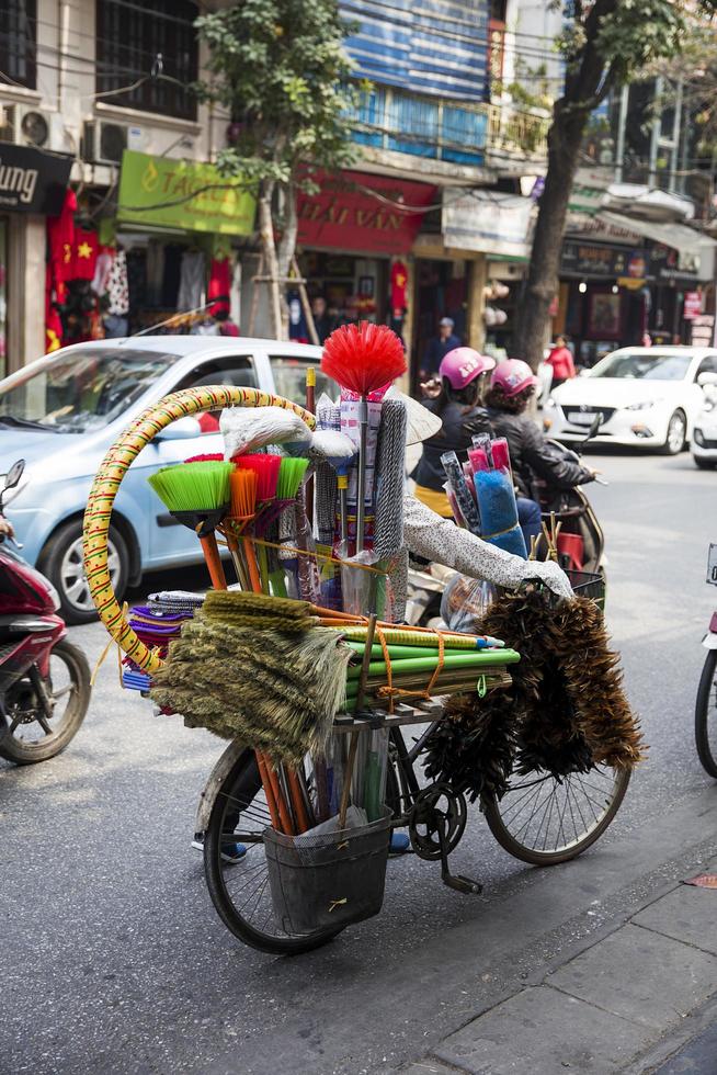 HANOI, VIETNAM, 2017 - Unidentified people on the street of Hanoi, Vietnam. At Hanoi, motorbikes have overtaken bicycles as the main form of transportation. photo