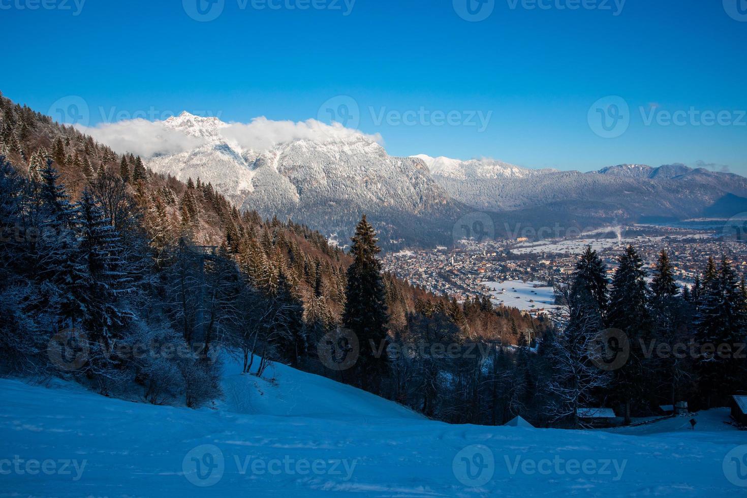 Ski slope over Garmisch partenkirchen with view over town photo