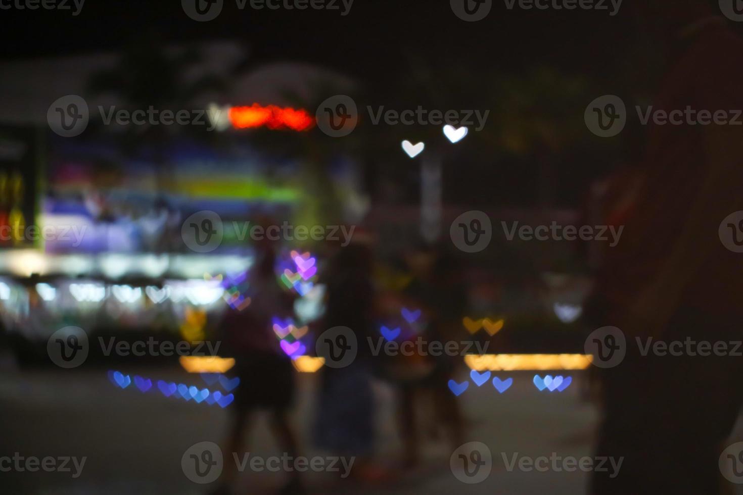 Blur people selfie with heart shape love valentine's day colorful object on night light photo