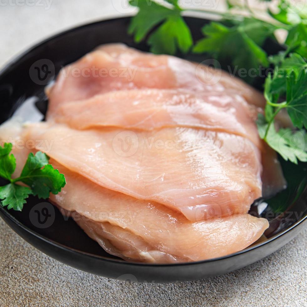 raw chicken breast slices poultry meat keto or paleo diet photo