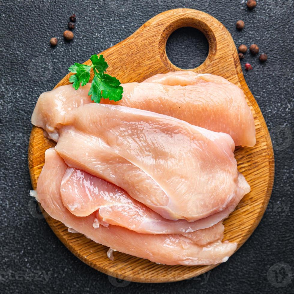 raw chicken breast slices poultry meat keto or paleo diet photo