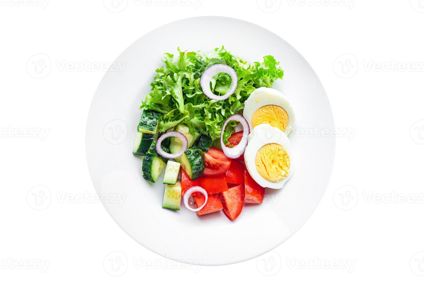 vegetables salad boiled egg cucumber, tomato, onion, lettuce healthy keto or paleo diet photo
