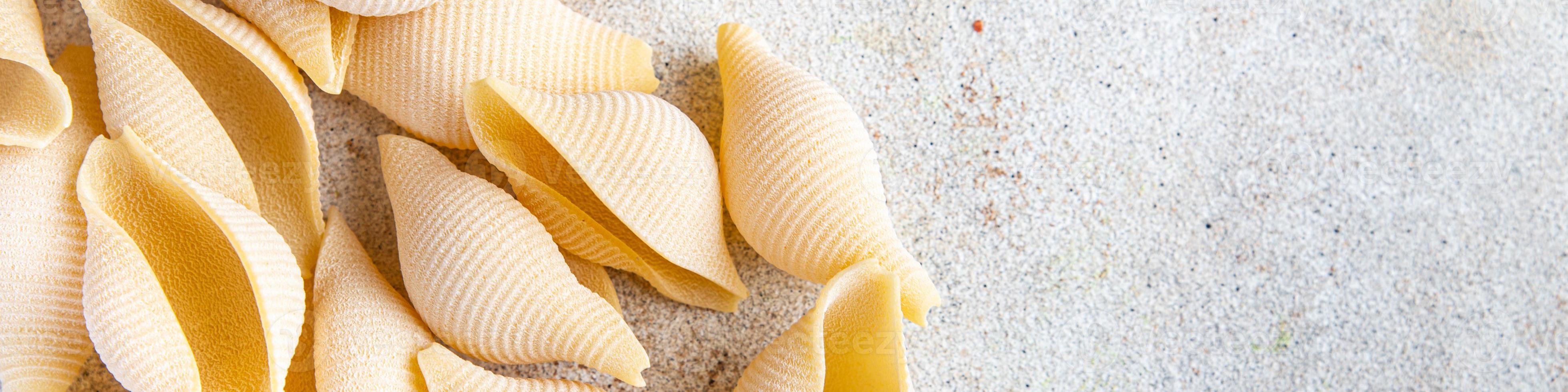 conchiglie pasta raw big shell durum wheat semola flour photo