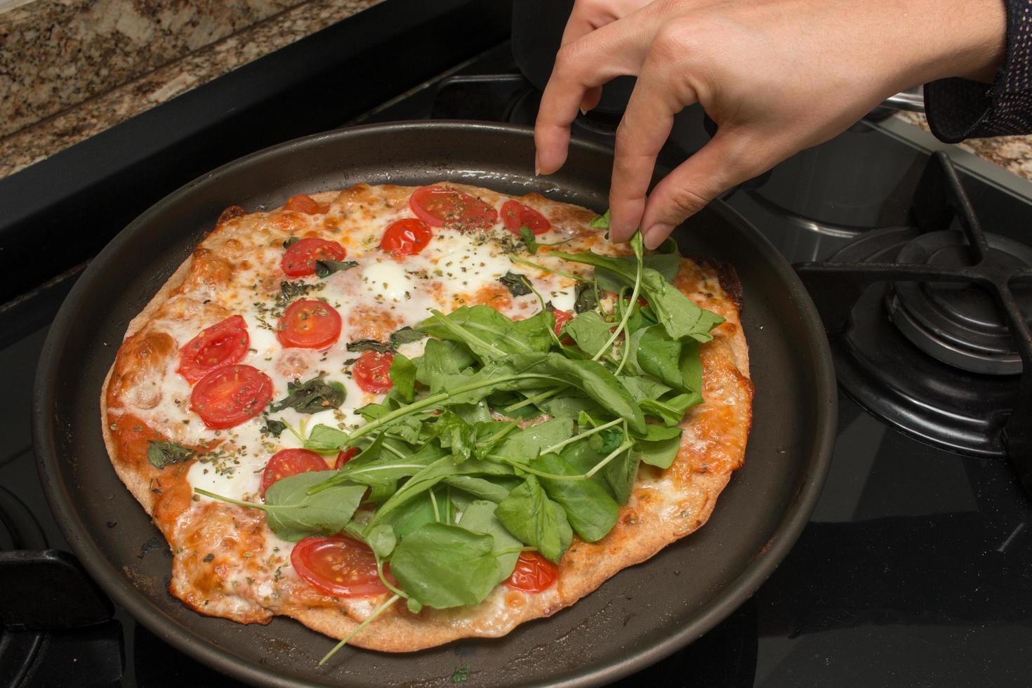 Delicious Homemade Pizza Margherita Ready to be Sliced and eaten photo