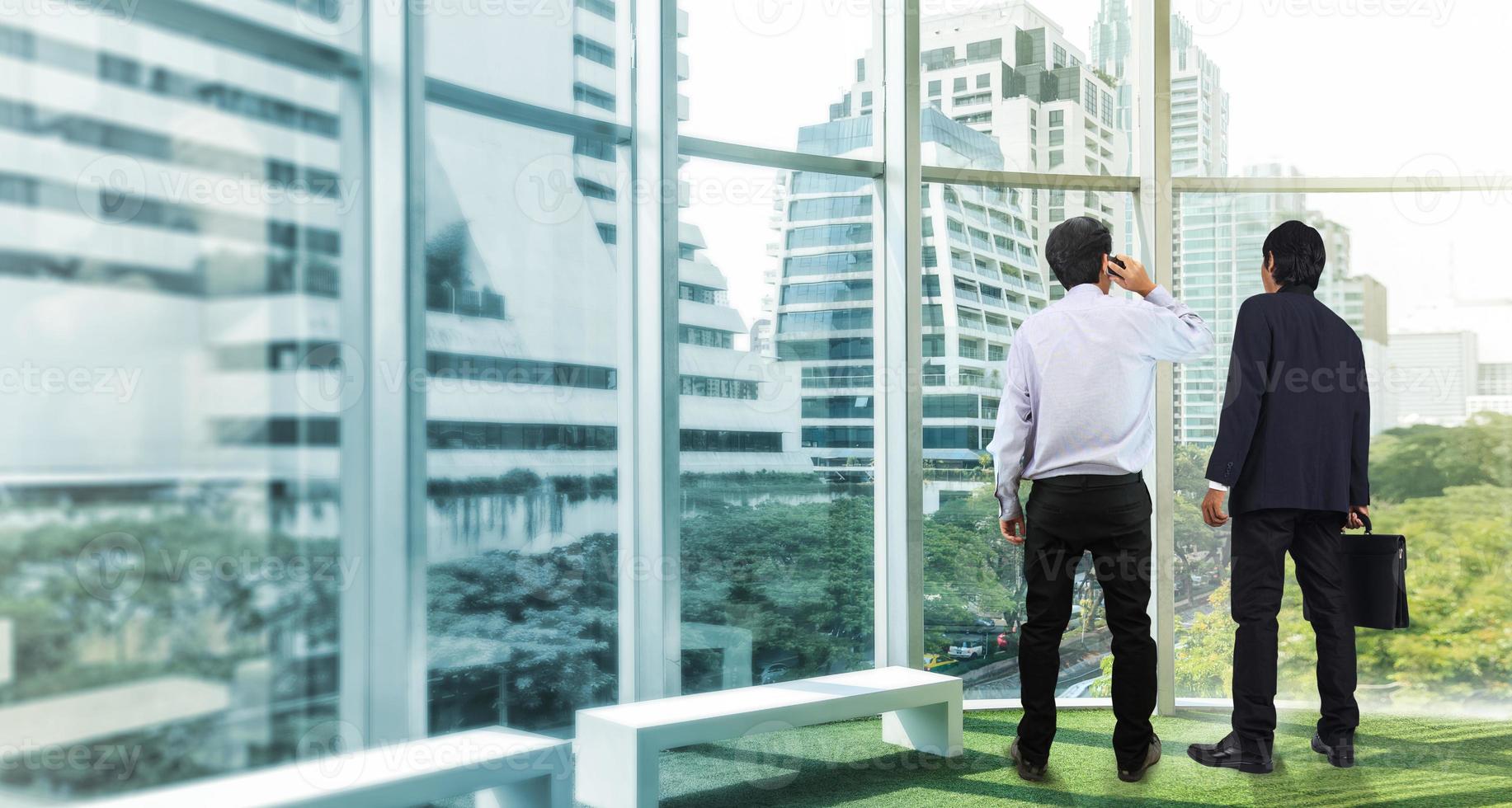 Businessman looking at city photo