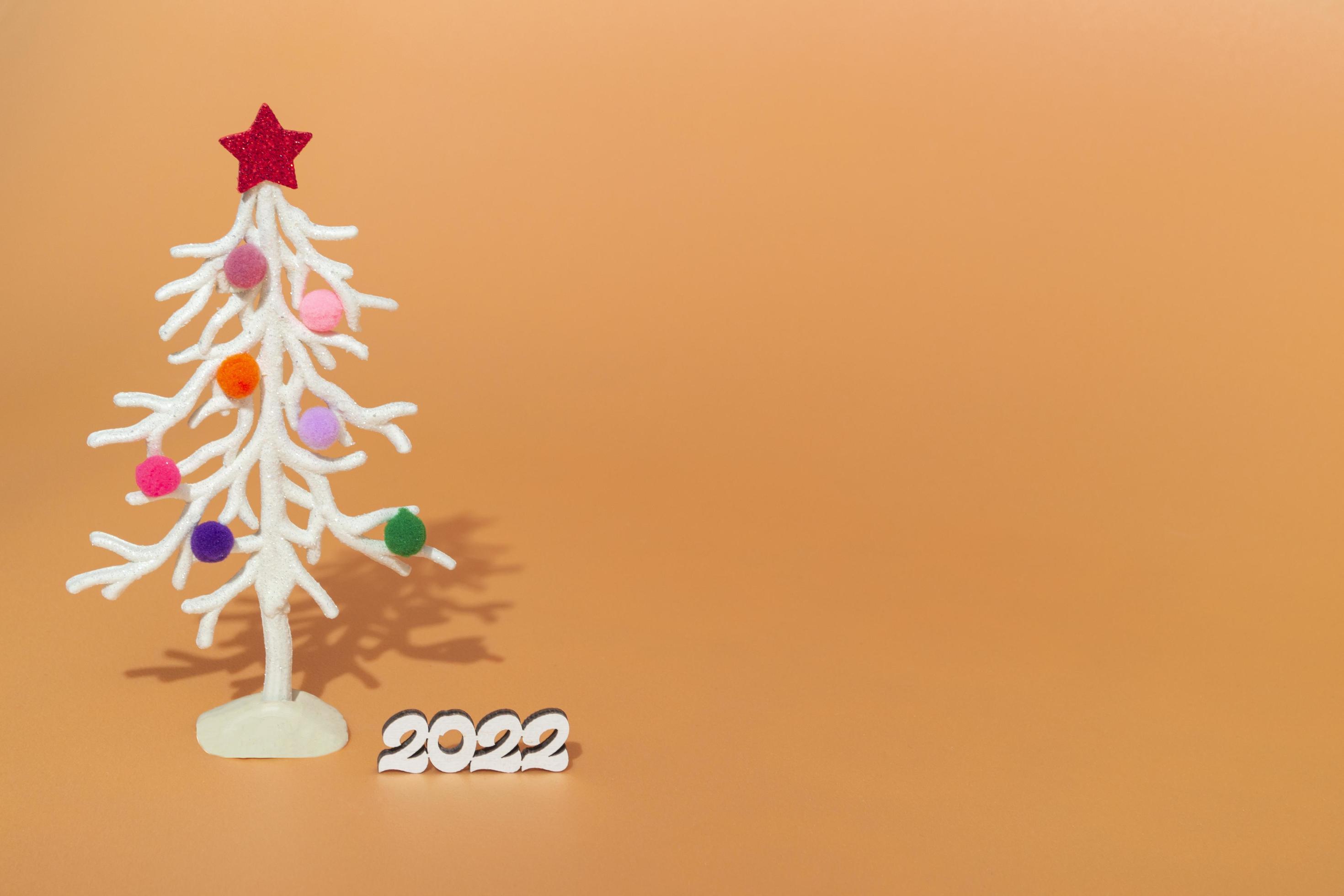 Free Christmas Light 2022 Christmas Card. Against The Background Of Christmas Lights, A White  Christmas Tree In Multi-Colored Fur Toys With The Numbers 2022. Copy Space  4823331 Stock Photo At Vecteezy