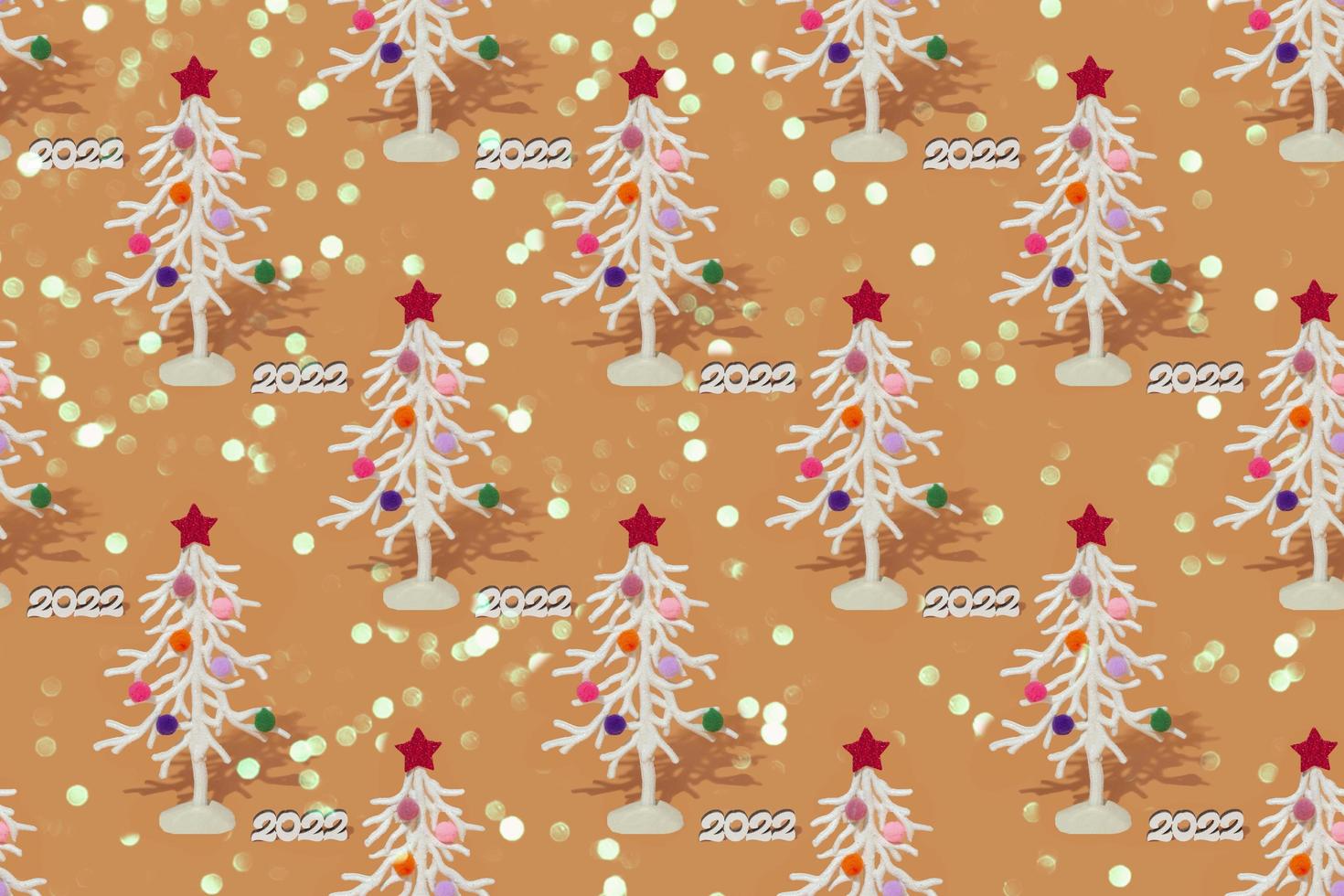 Christmas background, white fir tree with white numbers 2022. Seamless pattern on a colored background. photo