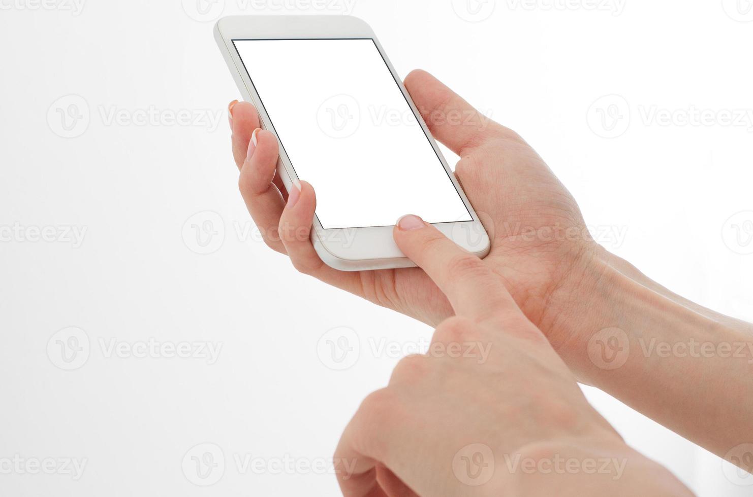 female hand hold mobile phone isolated on white, woman holding phone with empty display,blank screen,touching photo