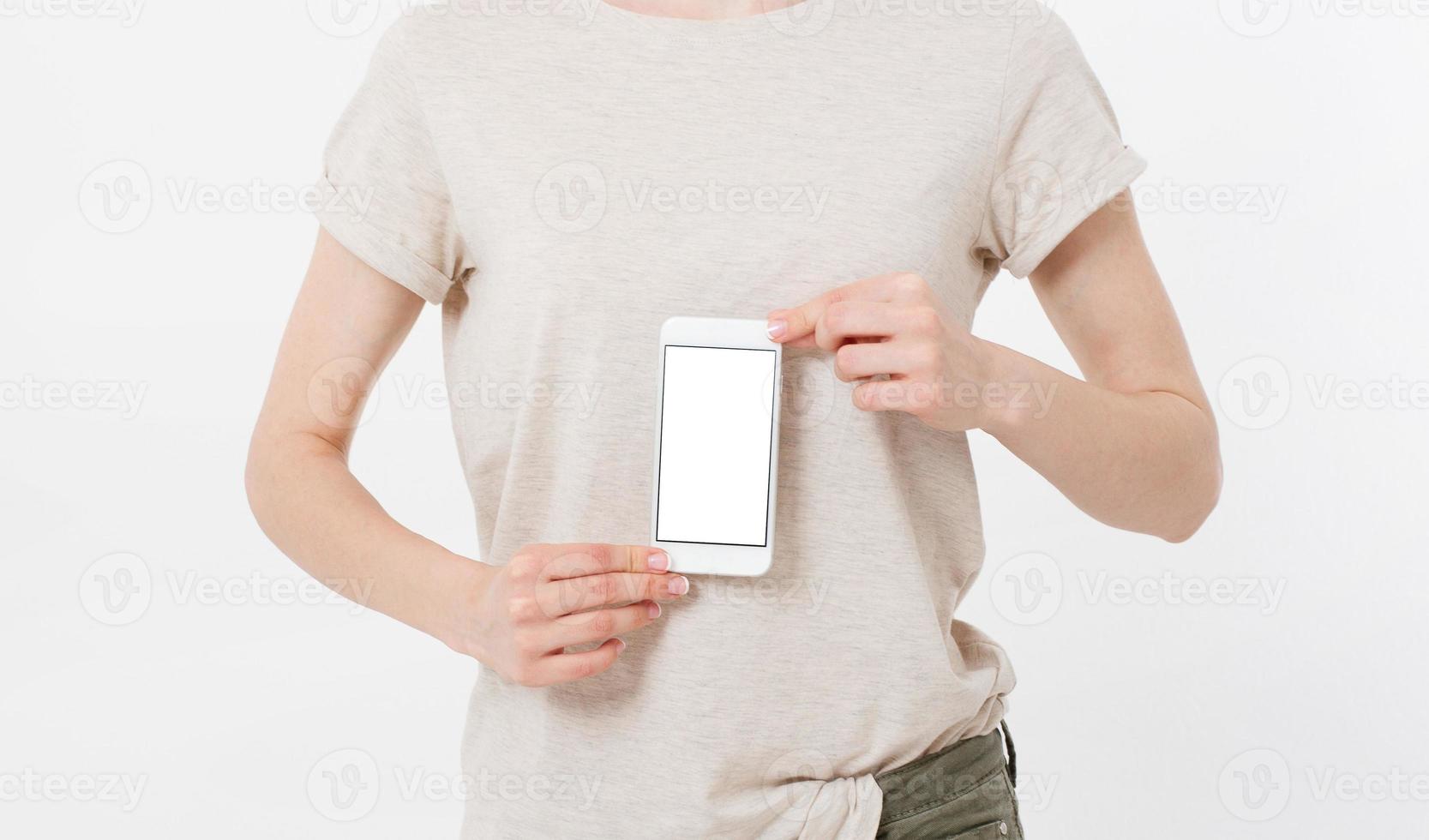 woman shows blank display of mobile phone, hand points to device, blank screen cellular photo