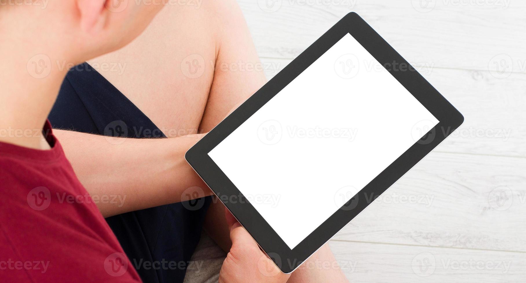 close up male hands , man using tablet, laptop and cellphone connecting wifi - empty display, blank screen photo