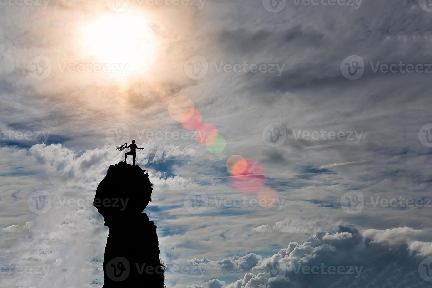 lone climber on the summit of the mountain after the conquest pr photo