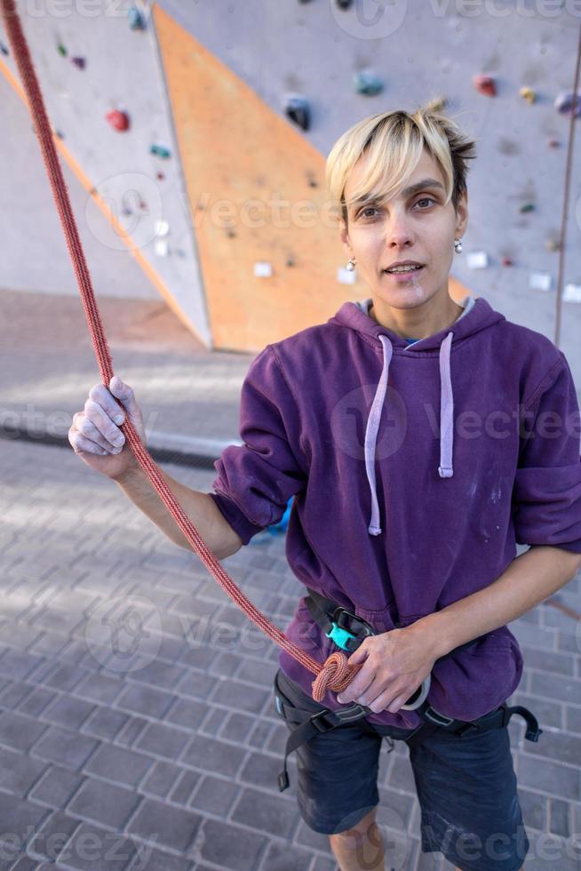 A rock climber trains on artificial terrain. photo