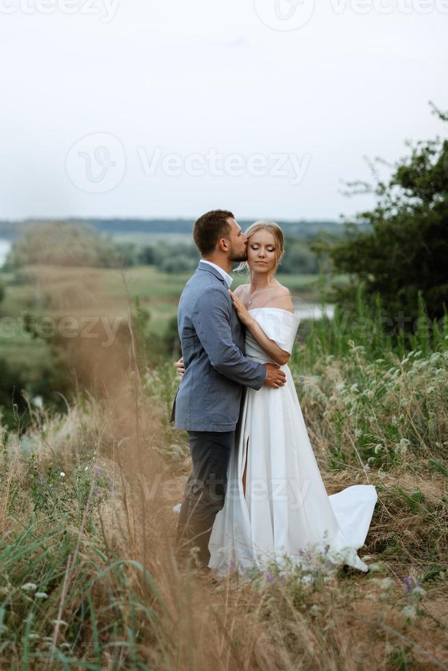 bride and groom on in the woods photo