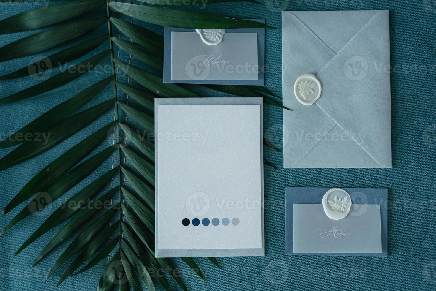 wedding invitation in a gray envelope on a table photo