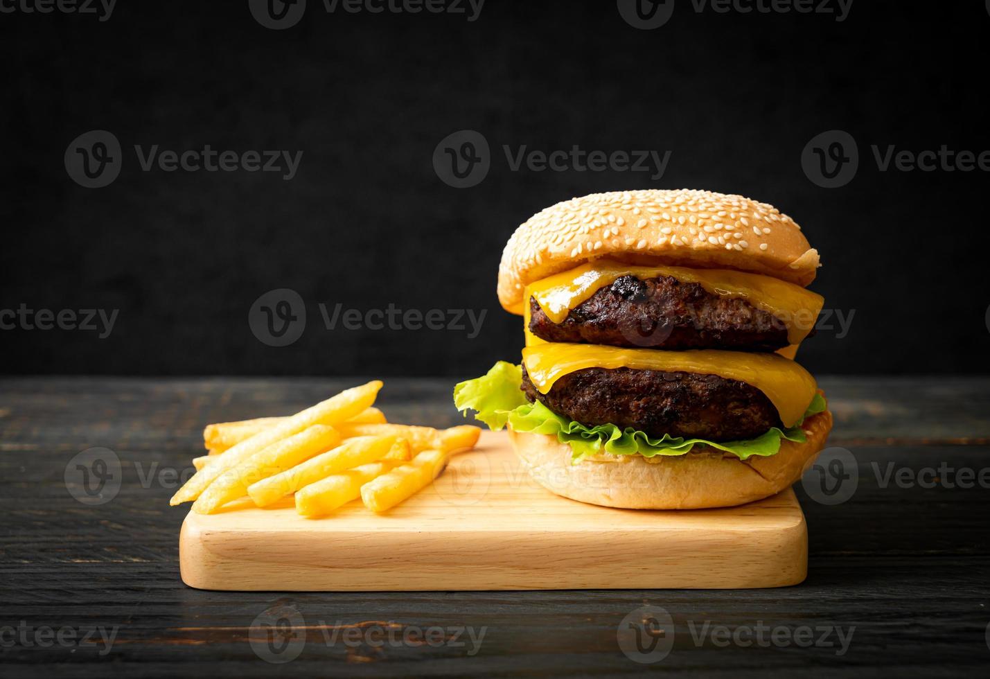 hamburger or beef burgers with cheese and french fries photo