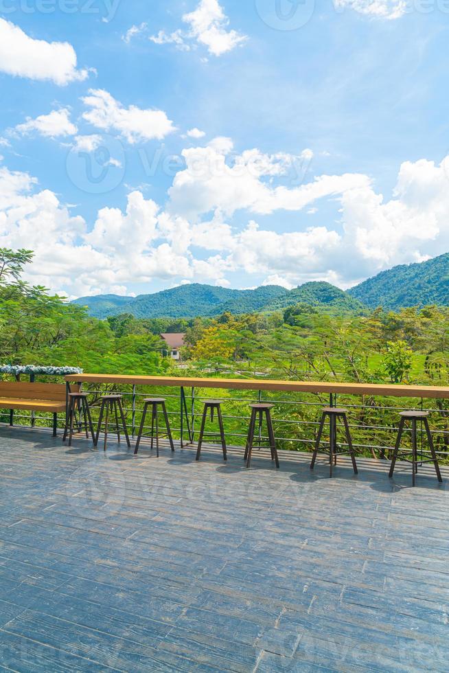 empty bench and bar stool on balcony photo