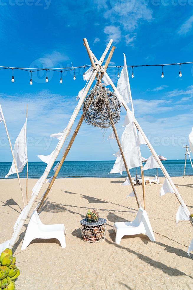 patio outdoor table and chair on beach with sea beach background photo