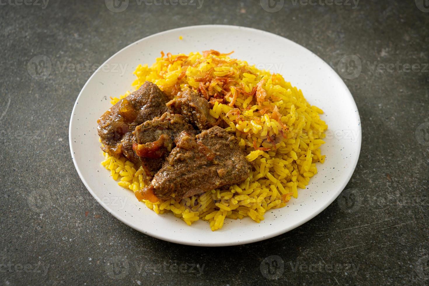 Beef Biryani or Curried rice and beef - Thai-Muslim version of Indian biryani, with fragrant yellow rice and beef photo