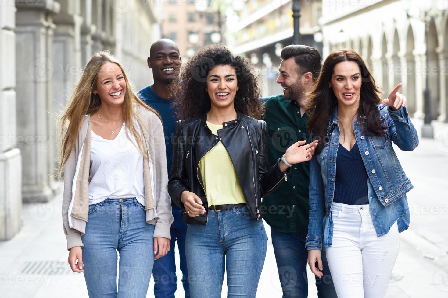 Group of friends having fun together outdoors photo