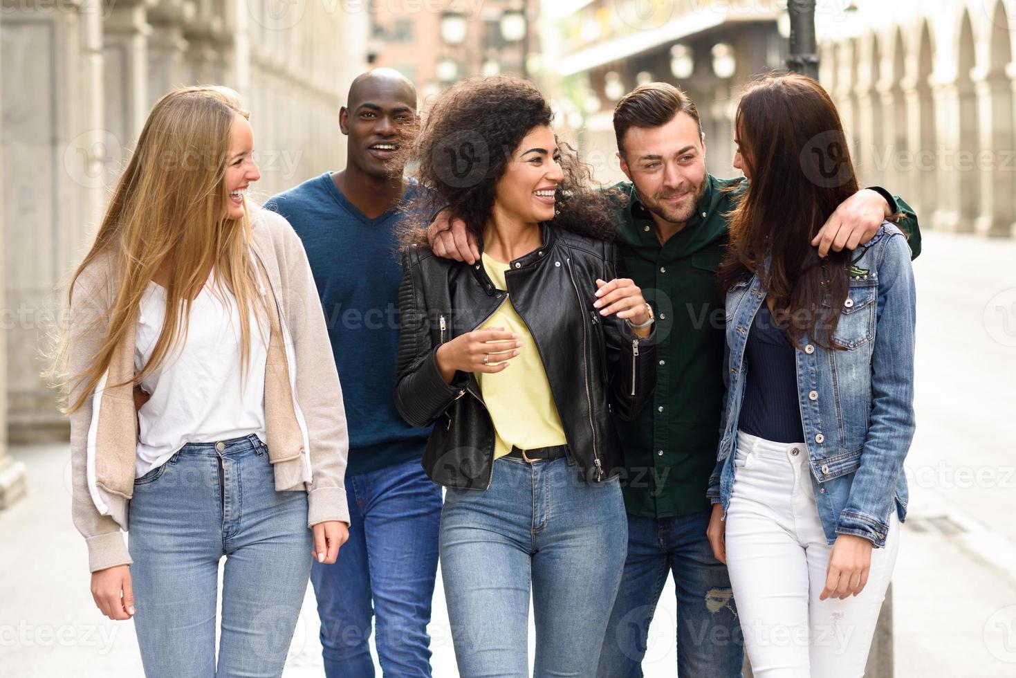 Group of friends having fun together outdoors photo