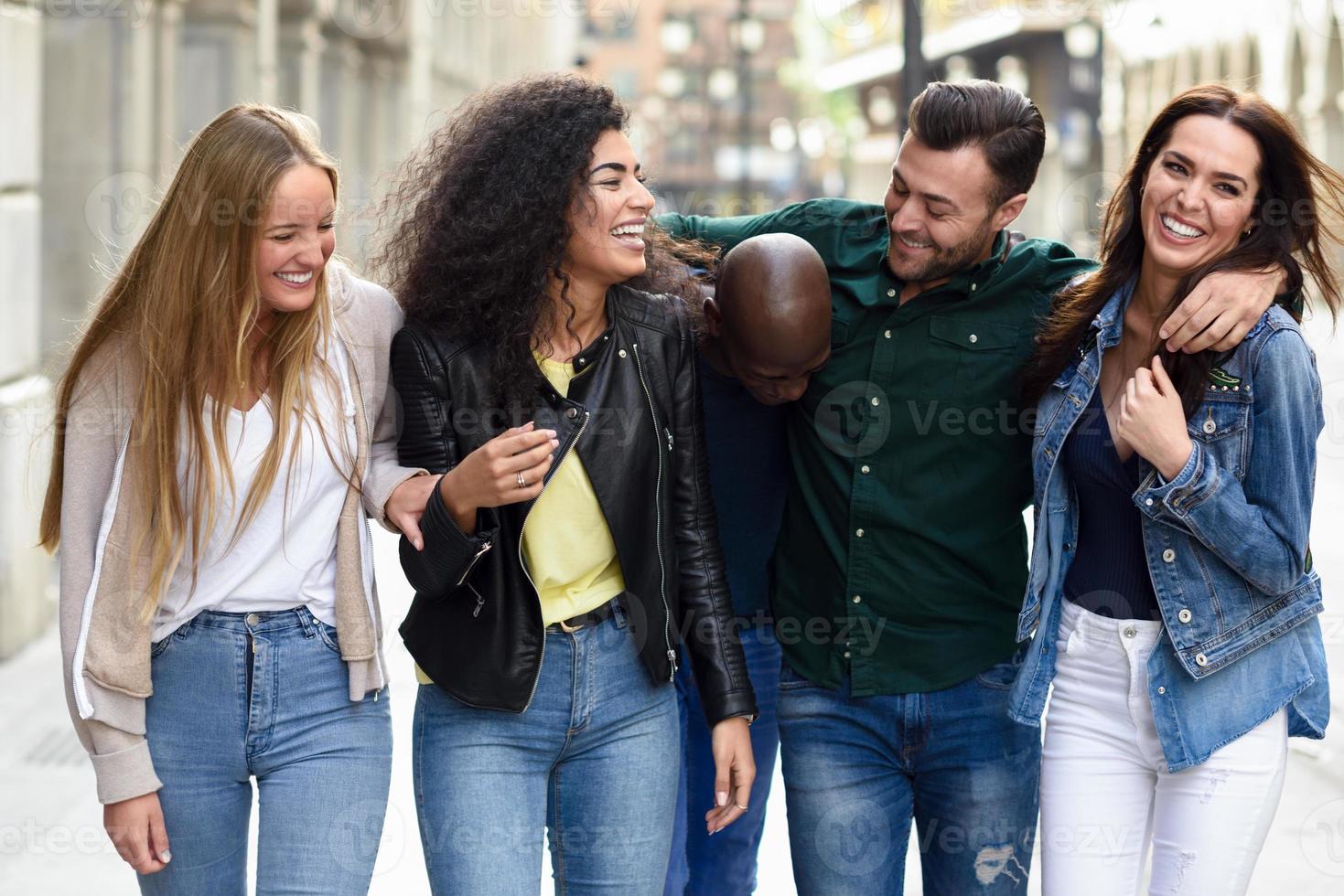 Group of friends having fun together outdoors photo