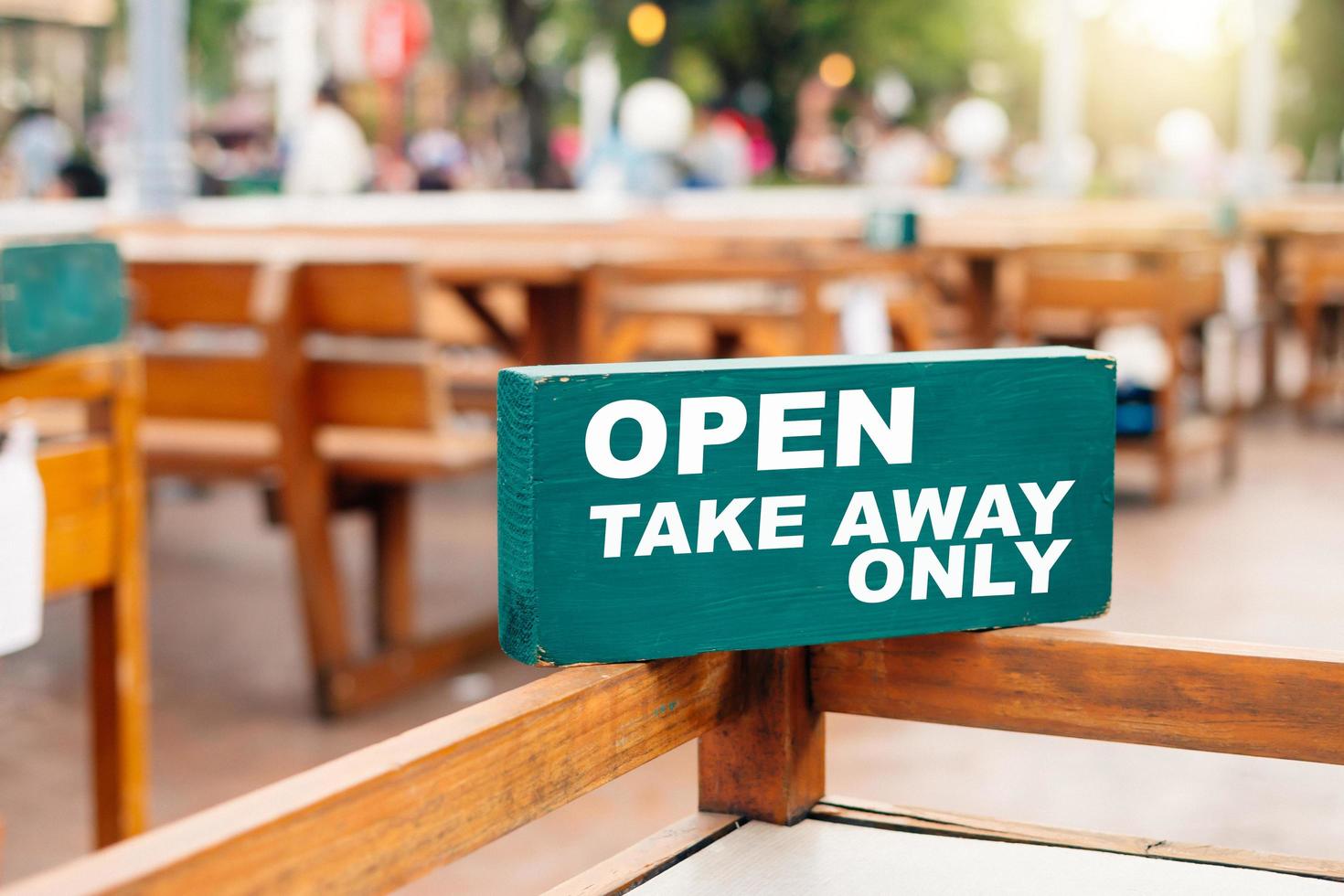 The restaurant sign informed customers that they would only order food to take home due to the coronavirus situation. photo