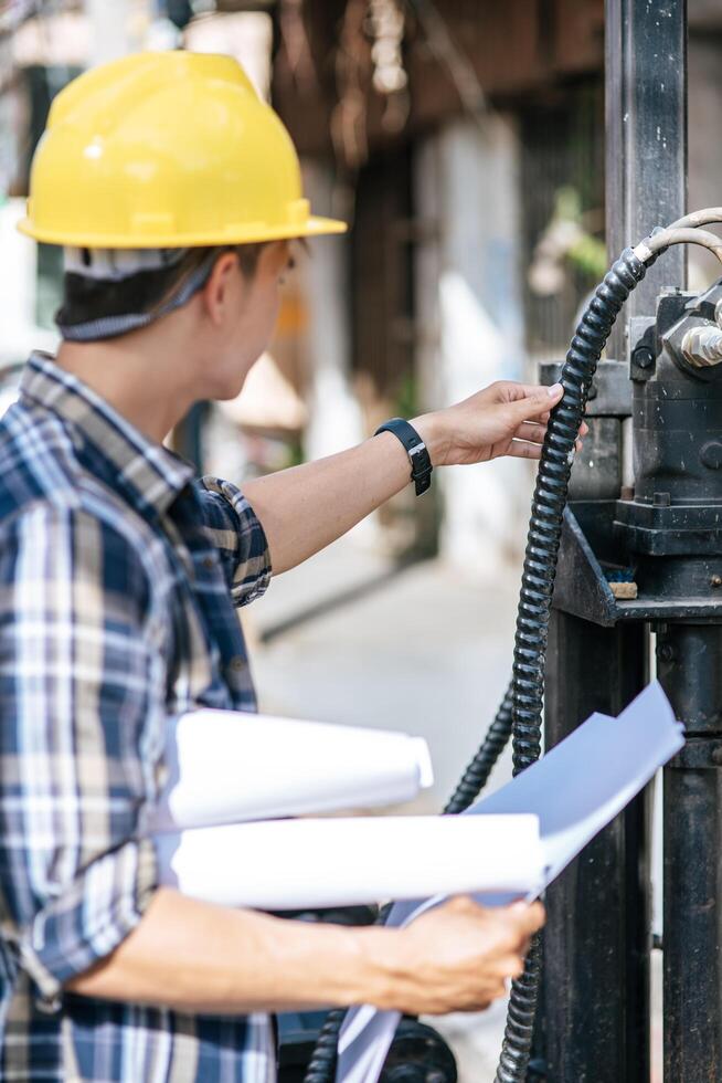 Civil engineers work on large road and machinery conditions. photo