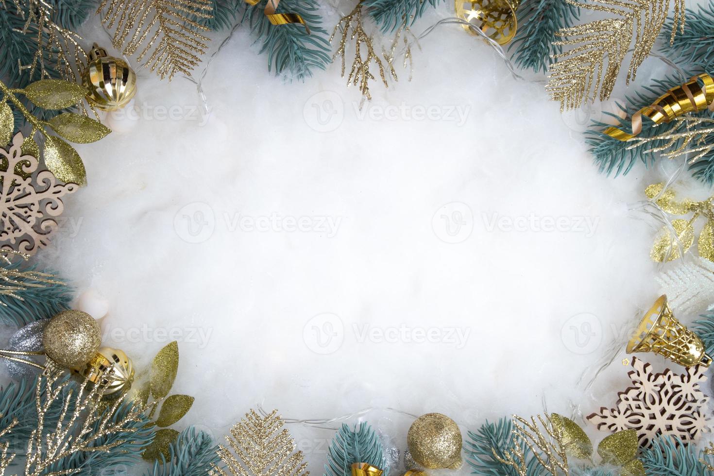 Happy Holidays text with frame made of Christmas decorations flat lay on snowy background photo