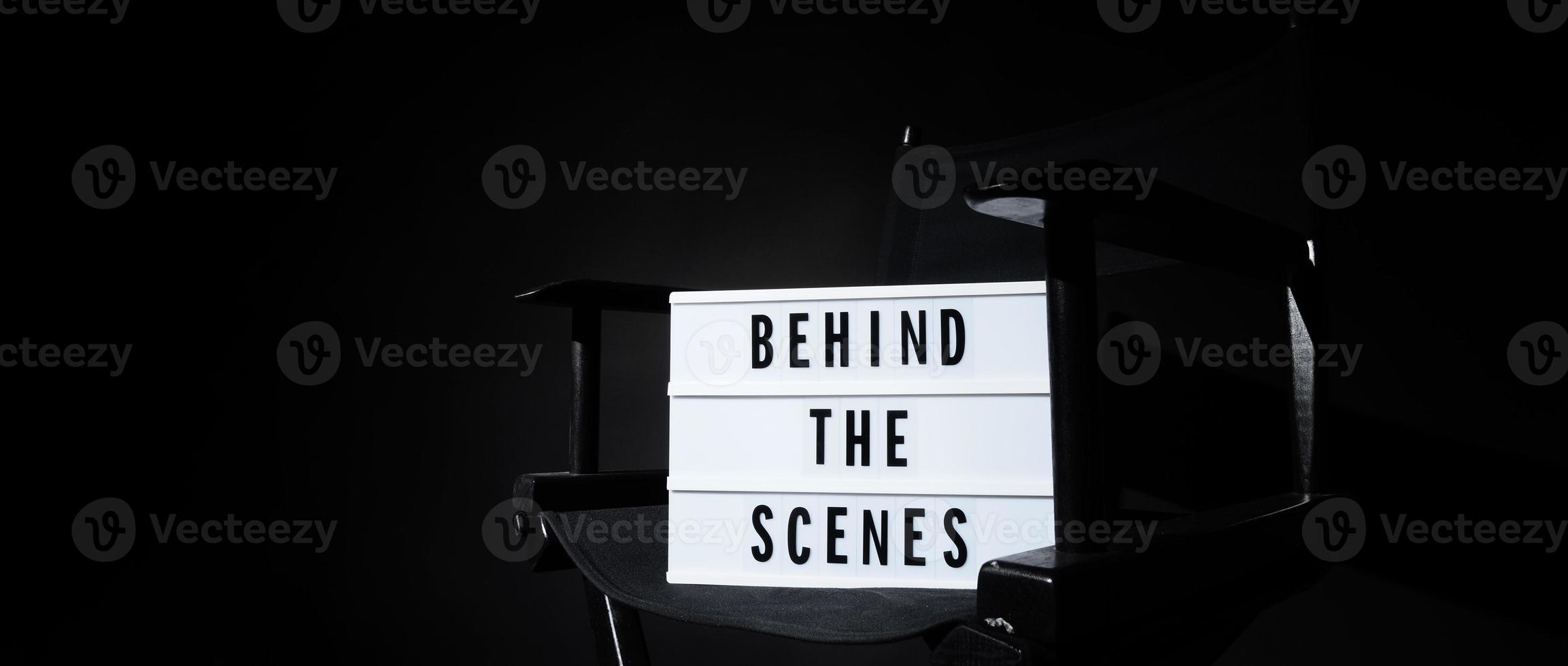 Director chair with behind the scene banner light box. photo