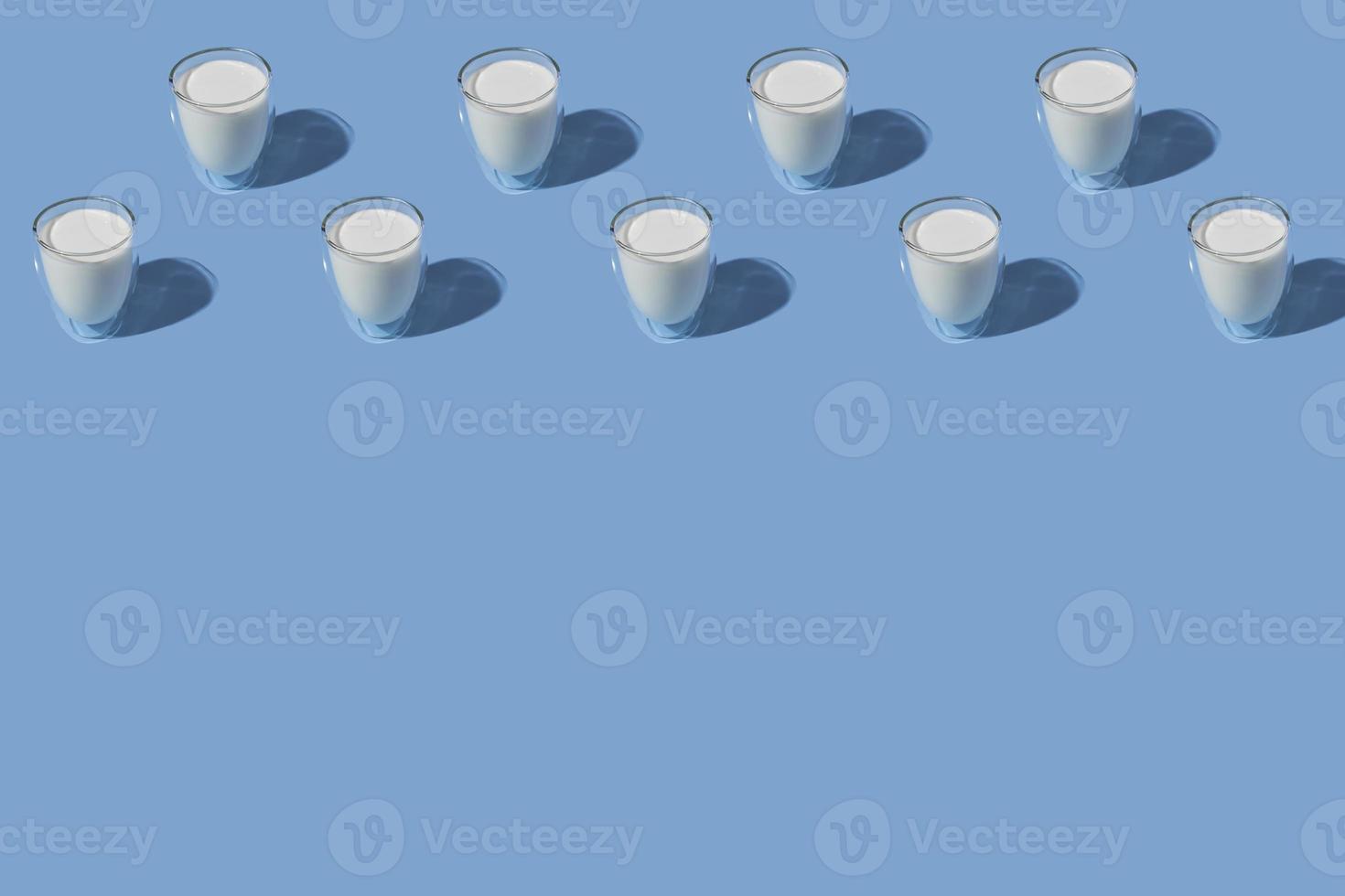 World Milk Day. Pattern on a blue background. A glass of milk. Pattern. photo