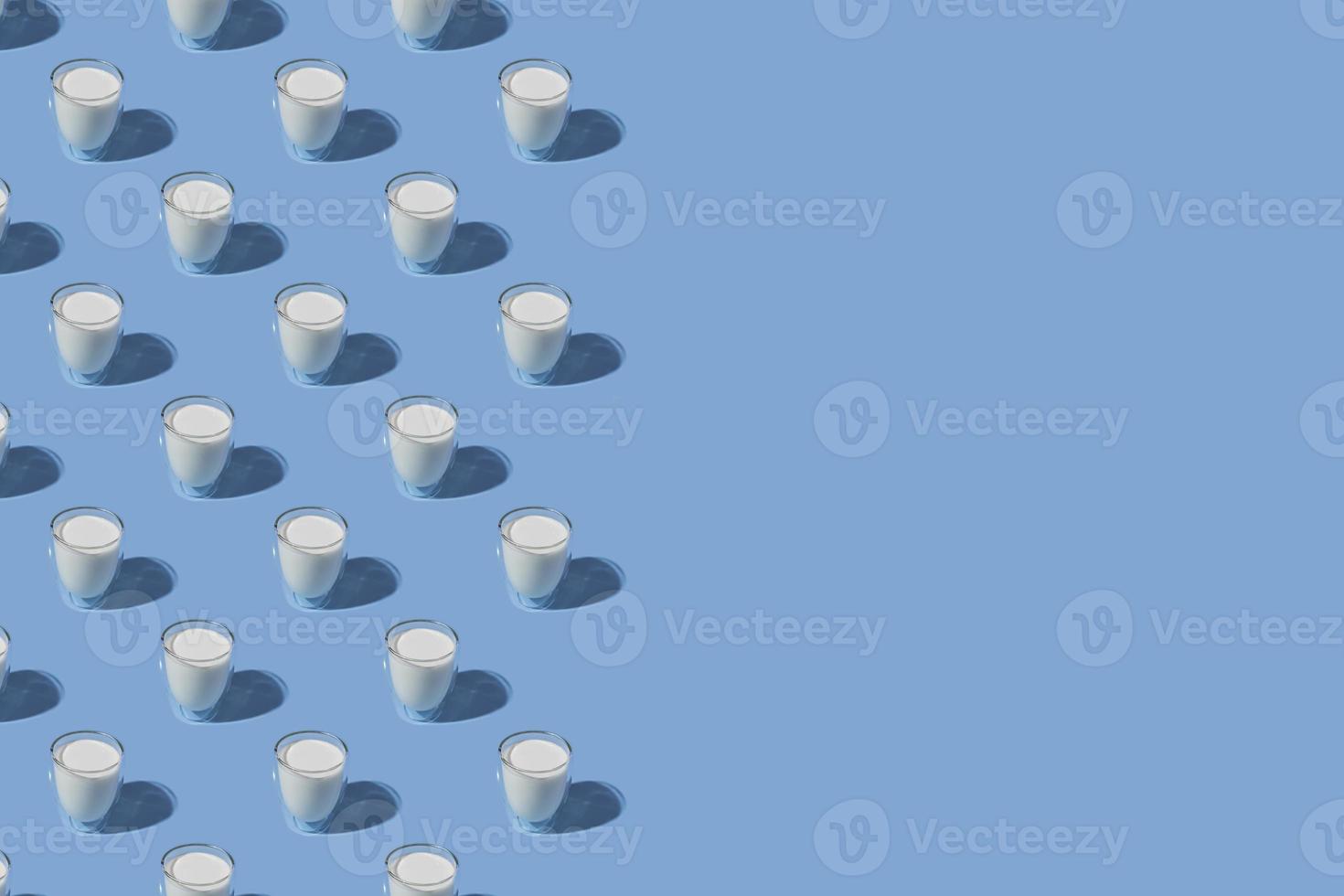 World Milk Day. Pattern on a blue background. A glass of milk. Sample. With space for text. copy space photo