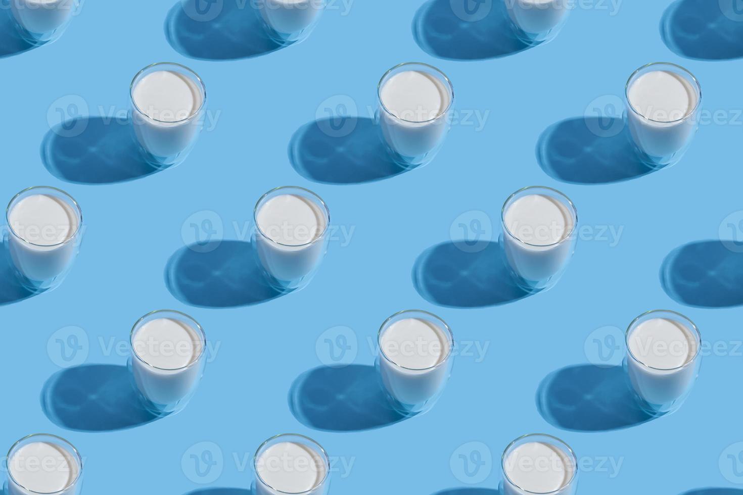 World Milk Day. Pattern on a blue background. A glass of milk. Template. Seamless pattern photo