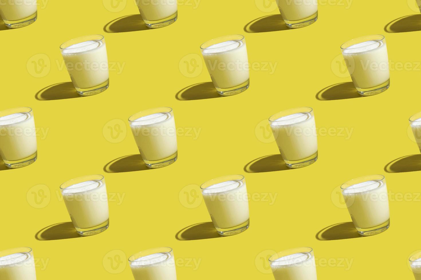 World Milk Day. Pattern on a yellow background. A glass of milk. Sample. photo
