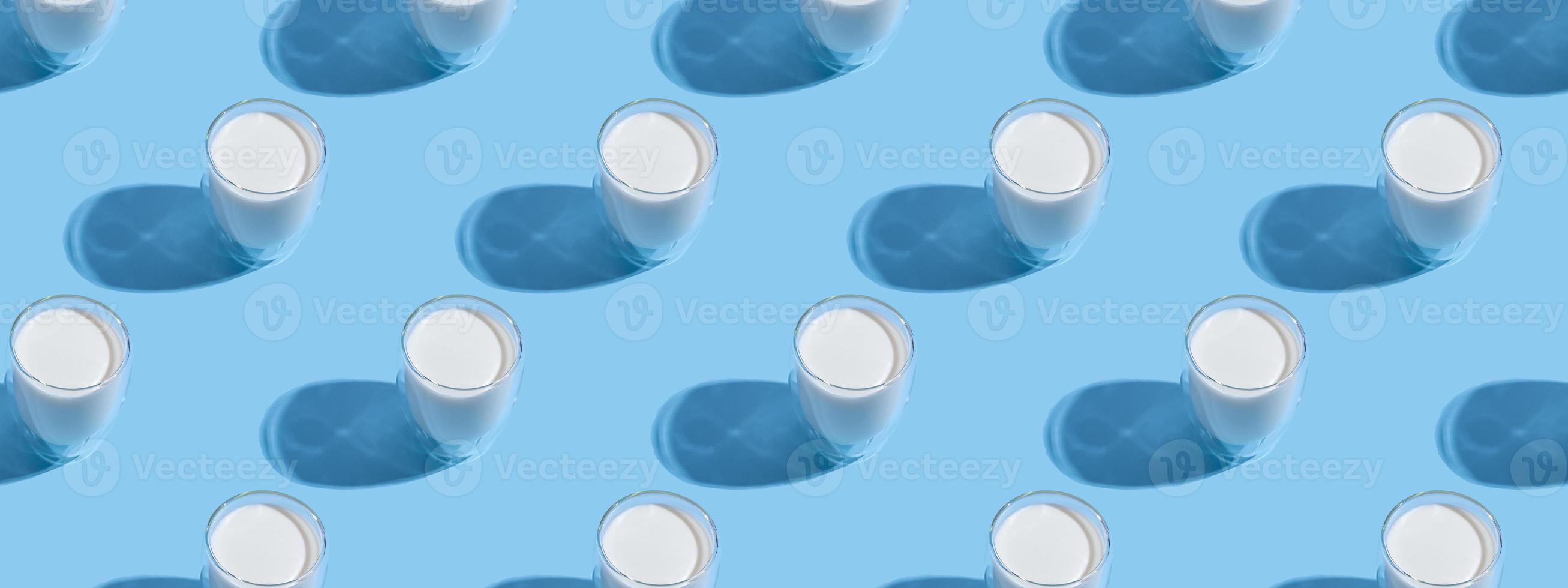 World Milk Day. Pattern on a blue background. A glass of milk. Template. Seamless pattern. Banner photo