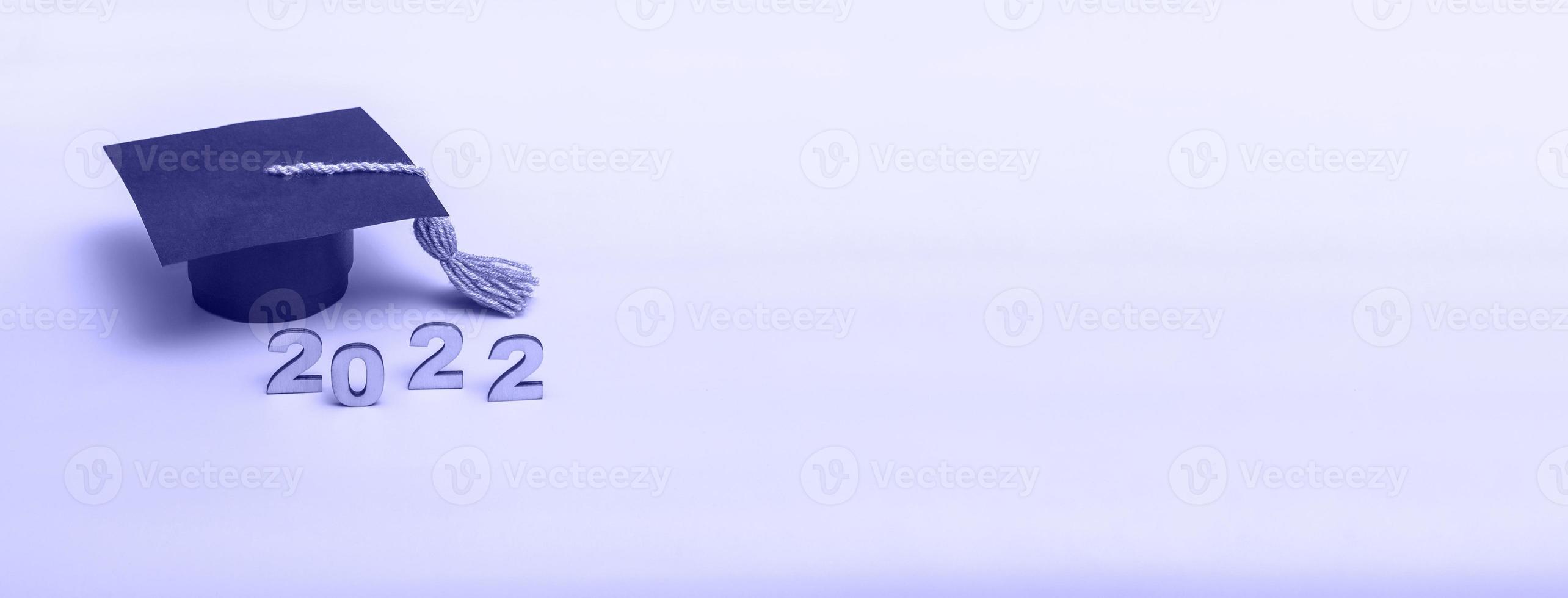 Gift box in the form of a graduation cap. 2022 release concept on very peri background copy space. Banner photo