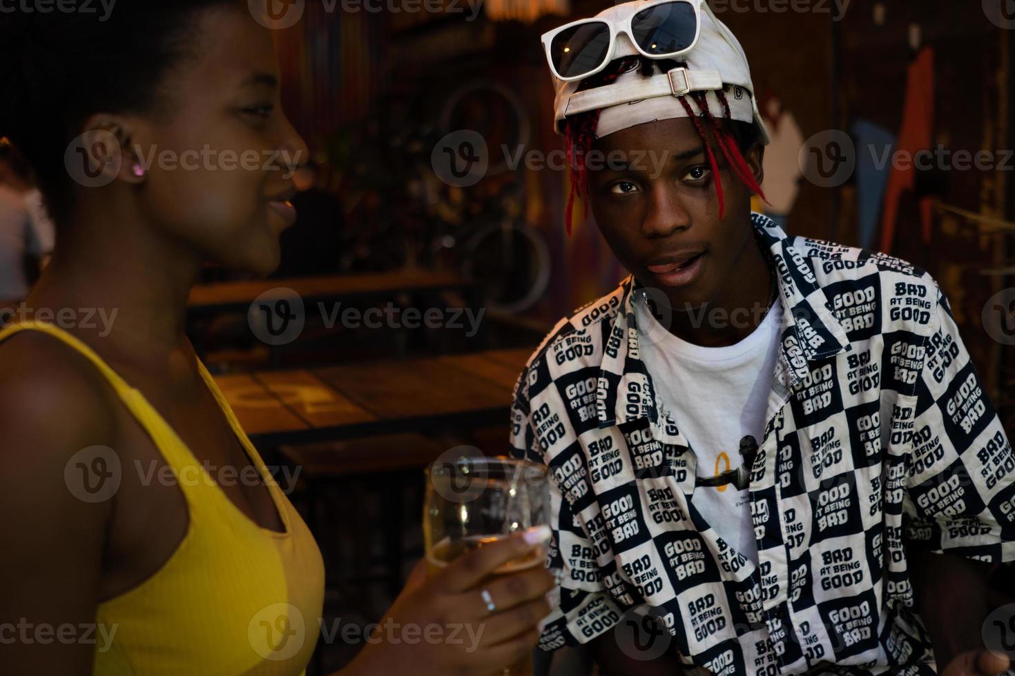 young afro guy looks at the camera with a provocative attitude photo