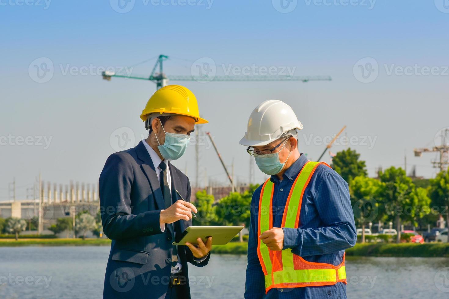 Engineer team Construction workers are planning construction project at the site outdoor photo