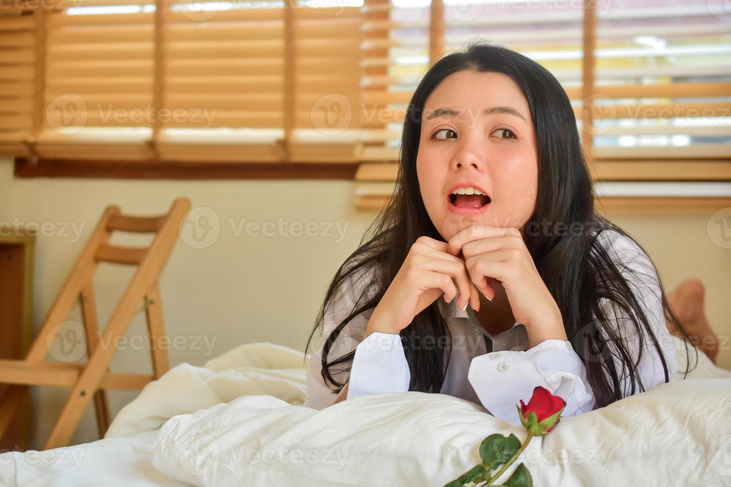 Lovely Happy women get up on bedroom morning photo