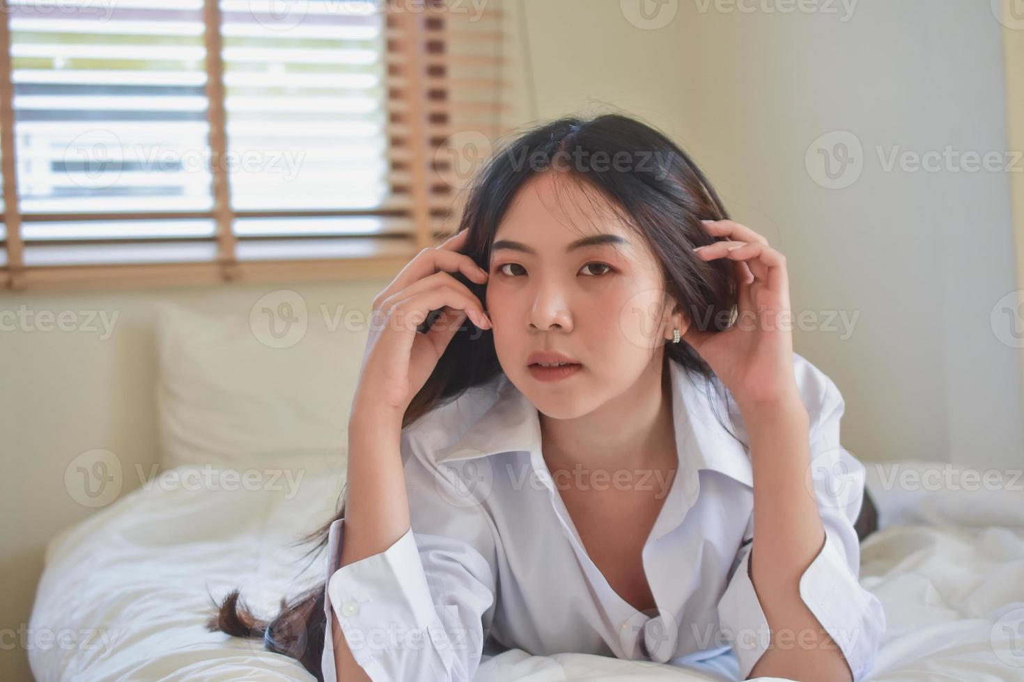Lovely Happy women get up on bedroom morning photo