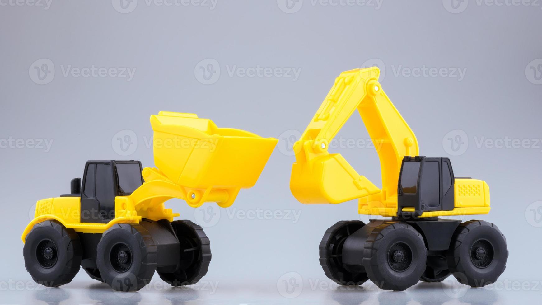 Heavy duty construction backhoe and Tractor toy on clear background. photo