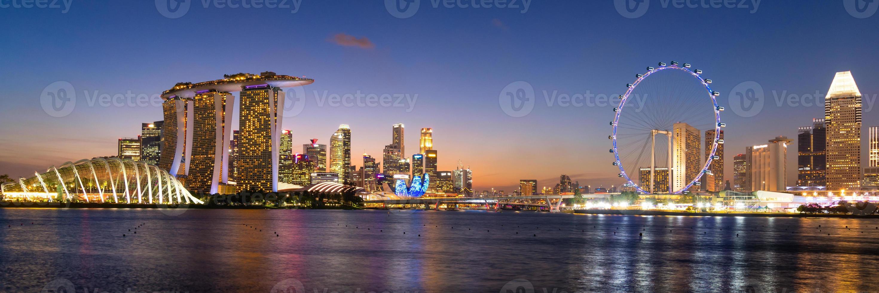 Panorama view of business downtown building area during twilight time at Singapore. photo