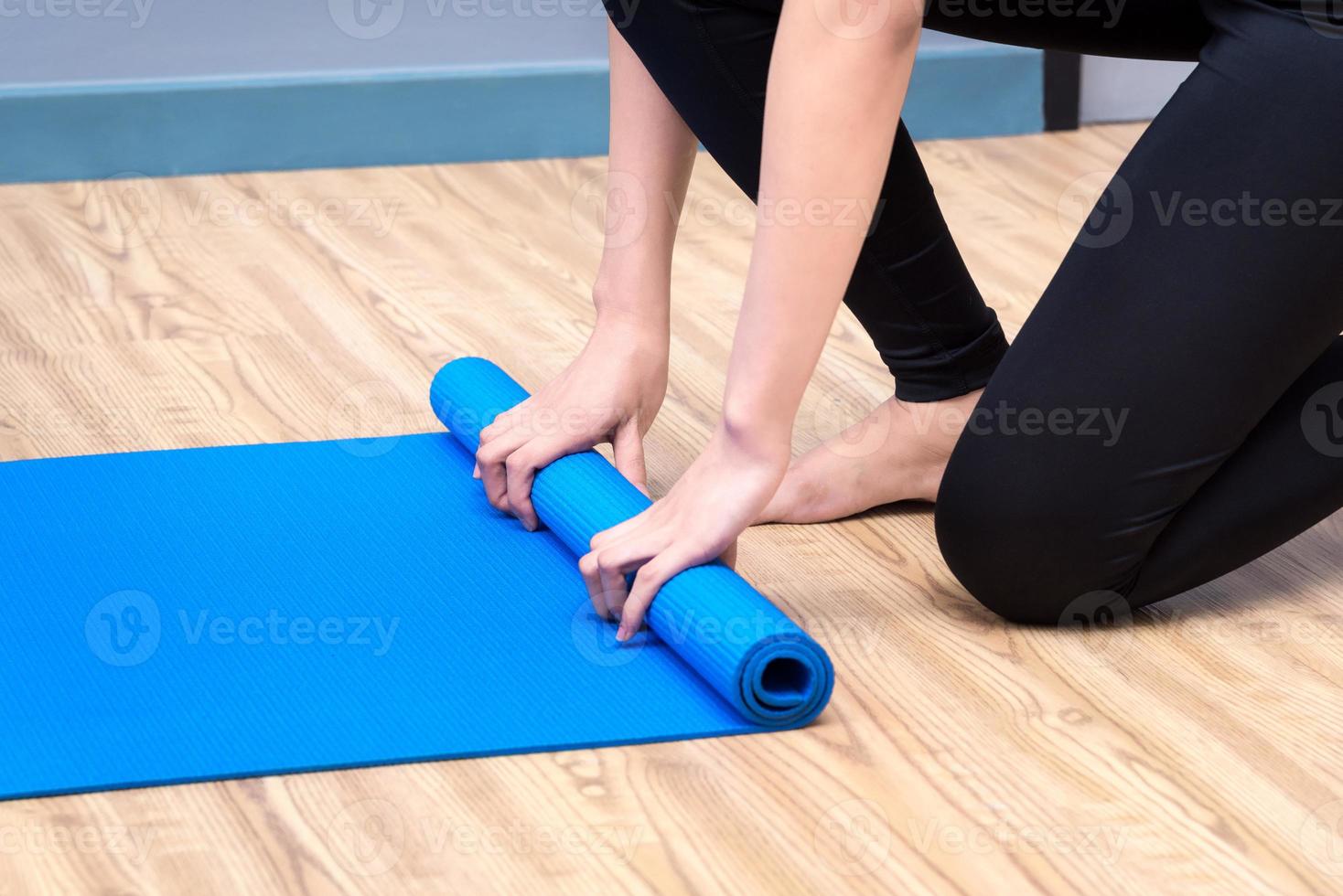 Healthy woman exercising yoga at sport gym, girl doing sport indoor.Photo design for fitness sporty woman and healthcare concept. photo