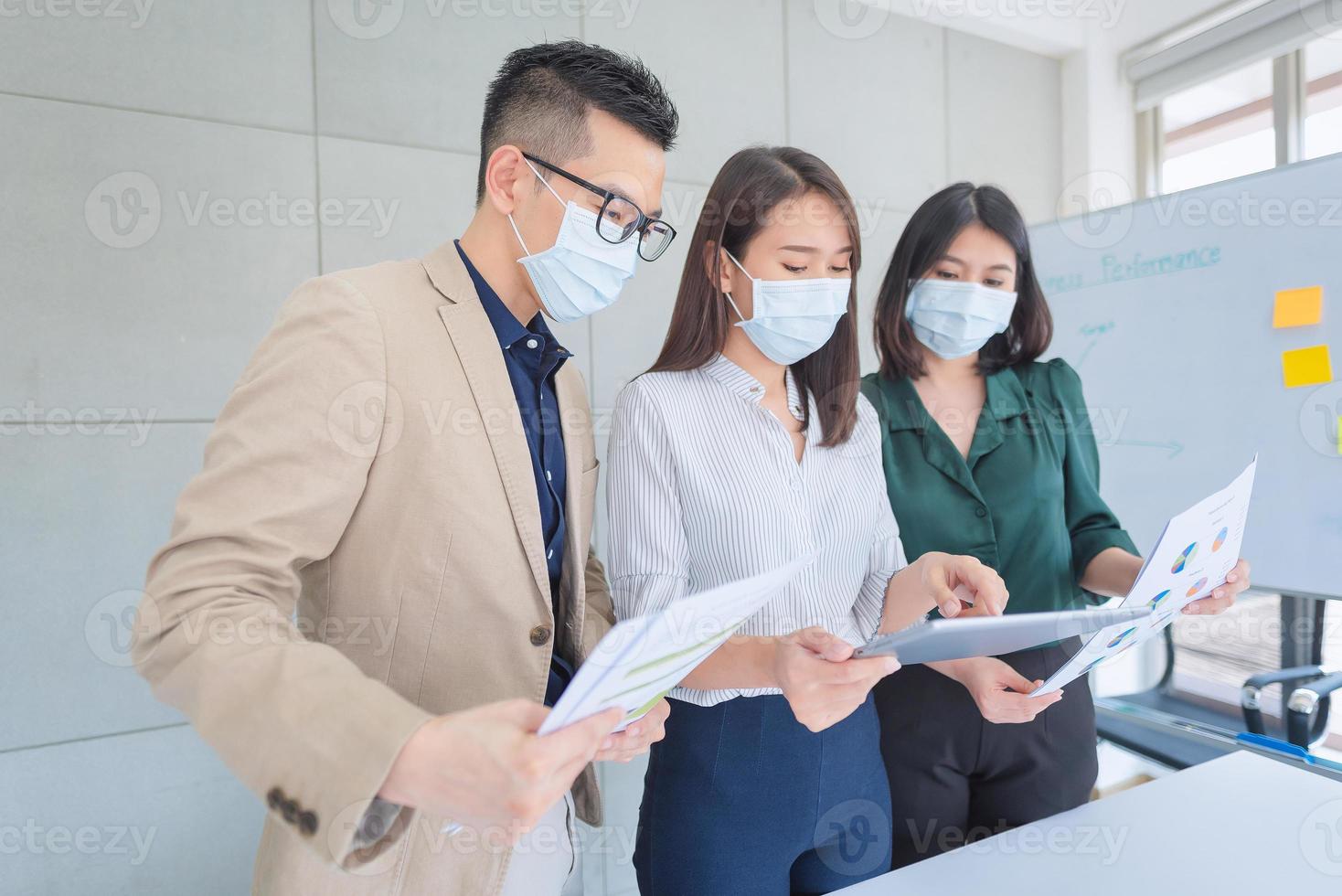 Business employees wearing mask during work in office to keep hygiene follow company policy.Preventive during the period of epidemic from coronavirus or covid19. photo