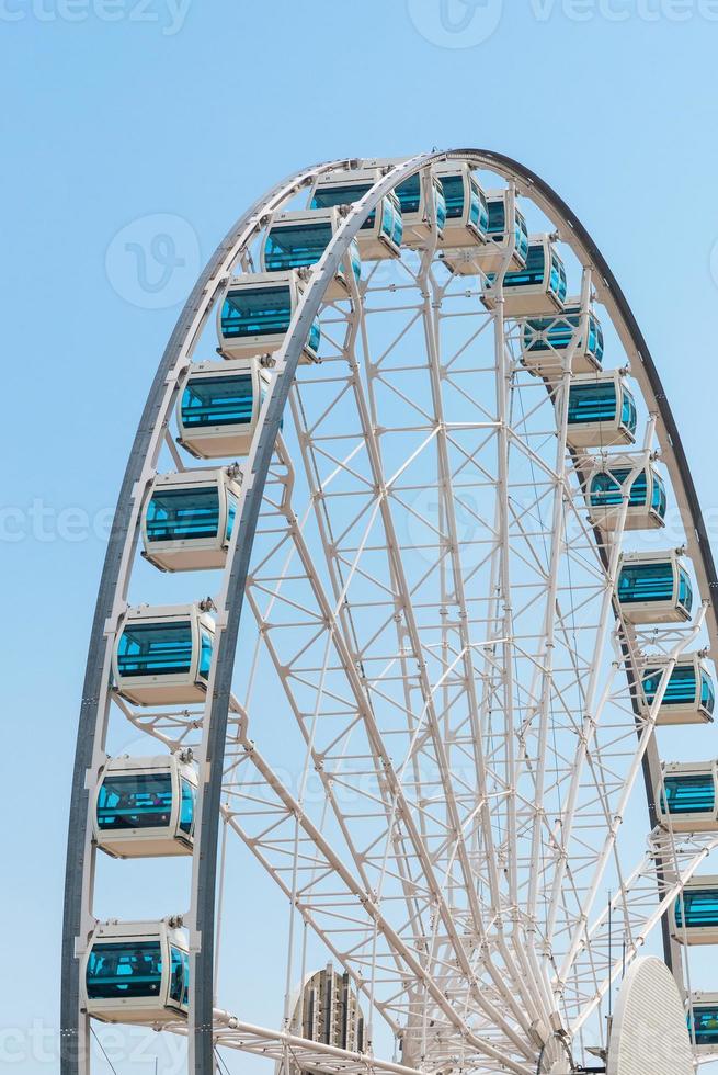 Close up Giant Ferris Wheel in Hong Kong near Victoria Harbor with clear sky background,Hong Kong. photo