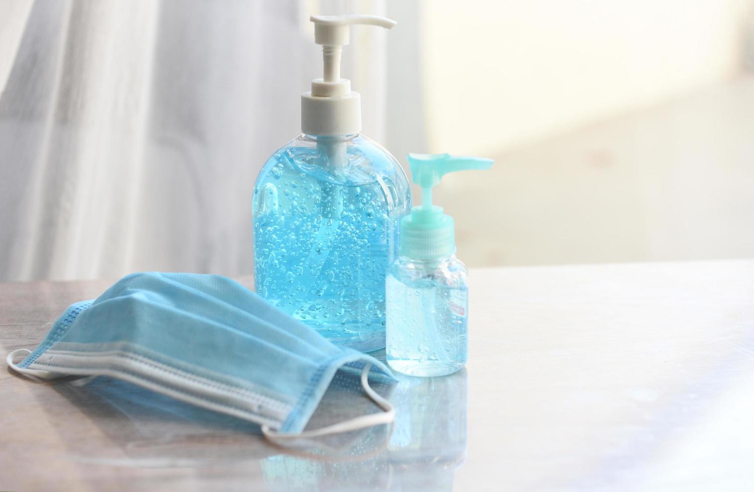 Face mask and product clean disinfectant kill virus bacteria germs hand sanitizer bottle gel for washing hands hygiene with alcohol gel and antibacterial soap sanitizer coronavirus prevention outbreak photo